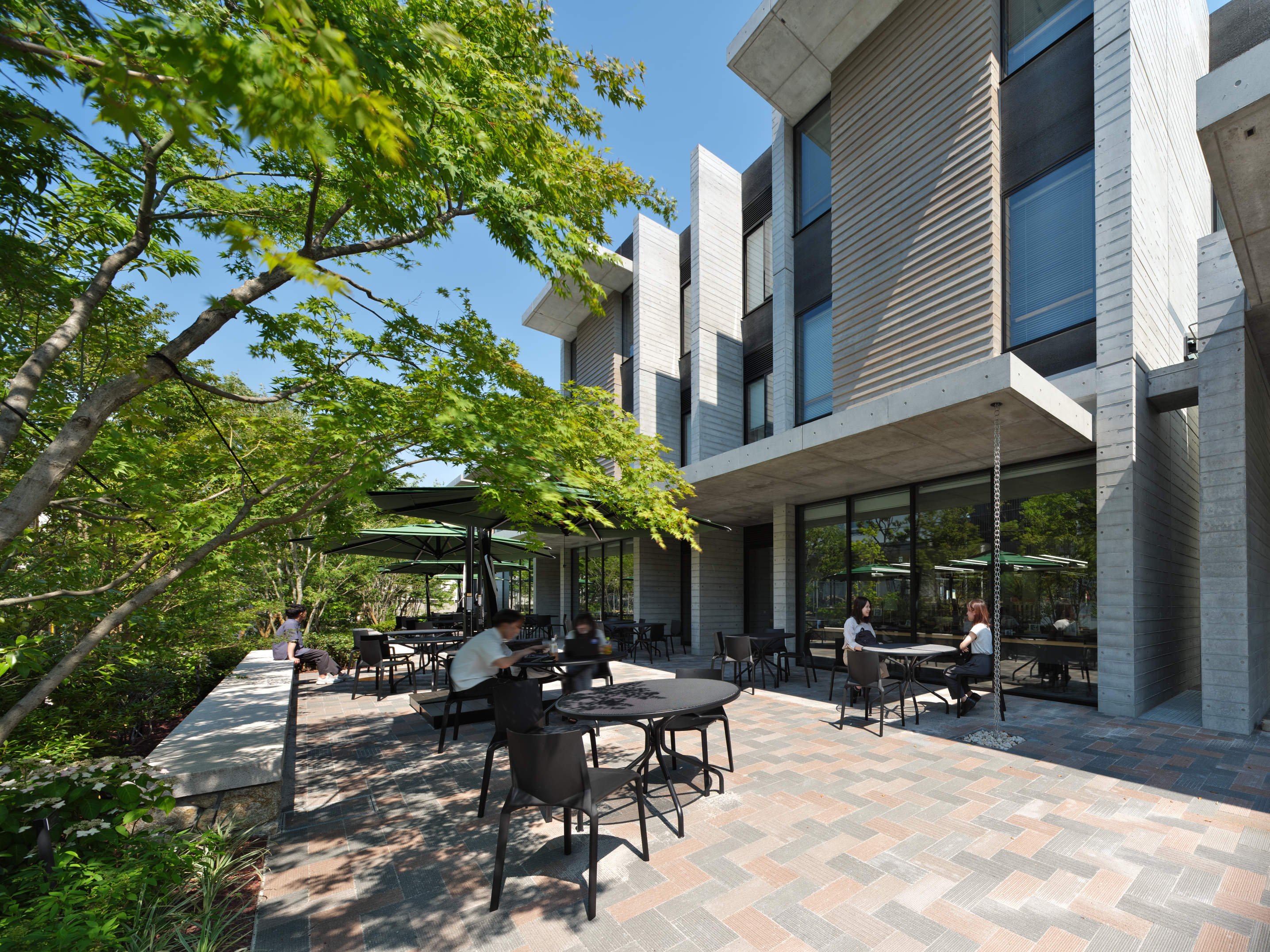 The "outdoor terrace" serves as a third place on campus