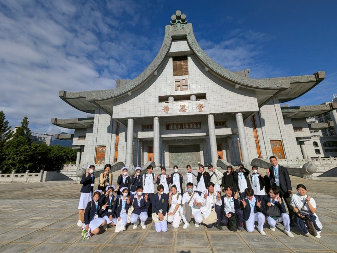 In front of the "Serenity Hall," a facility built by the founder of Tzu Chi (Reverend Zheng Yan) with donations from the public